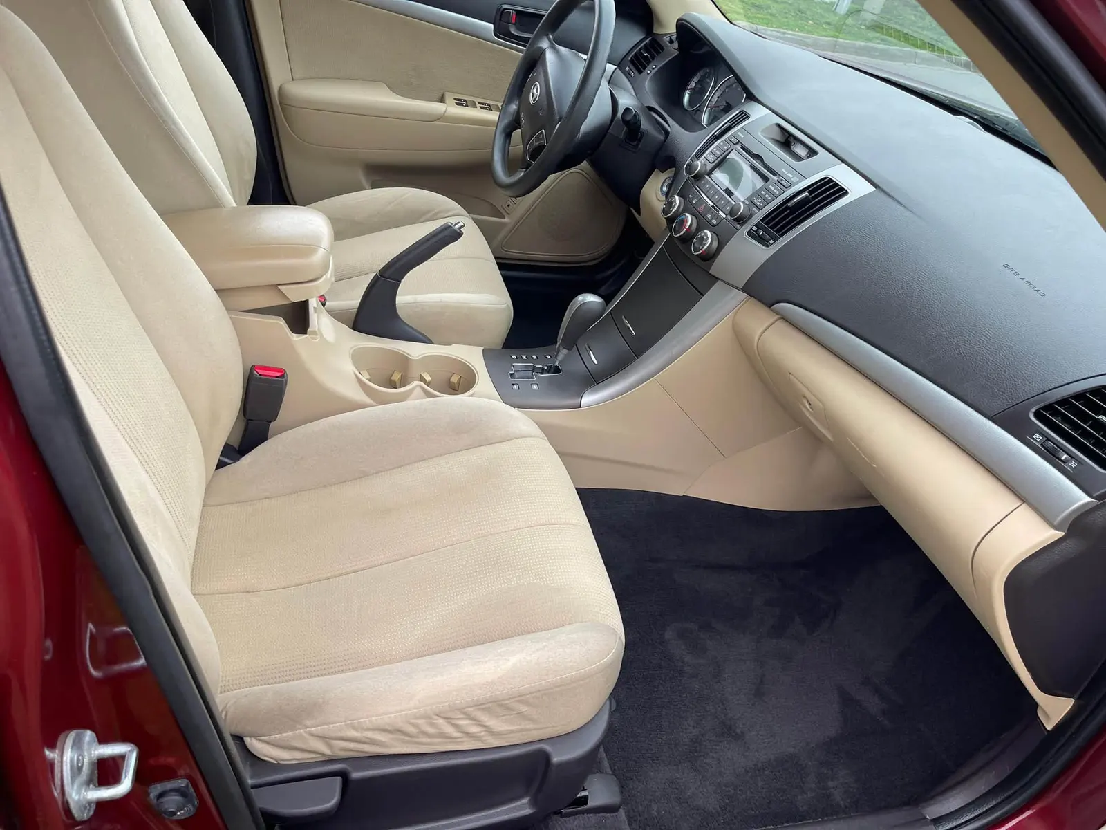 Deep-cleaned tan leather car interior in Burnsville