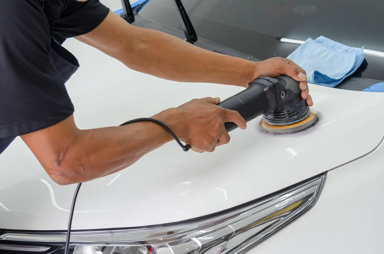 Hand polishing a car's paint to a shine in Burnsville
