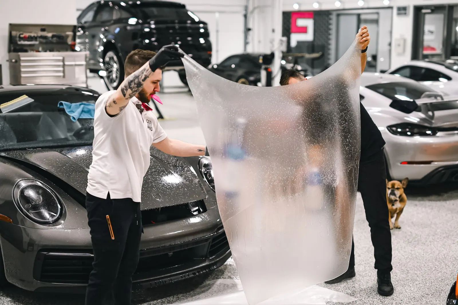 Window tinting film being applied to a car window in Burnsville